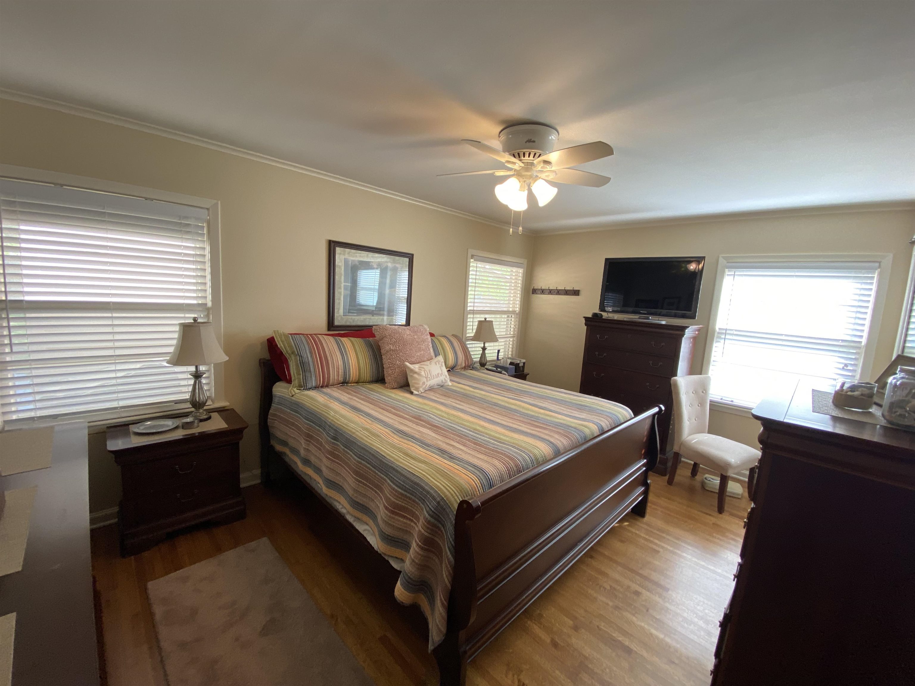 5111 Mason Road Memphis, TN 38117 - Photo 20 of 23 a bedroom with a bed and wooden floor