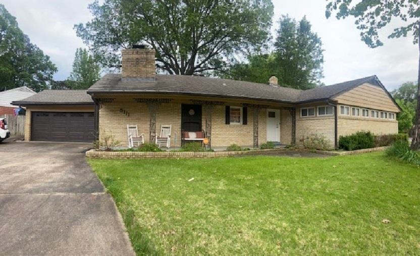 5111 Mason Road Memphis, TN 38117 - Photo 3 of 23 a front view of a house with garden