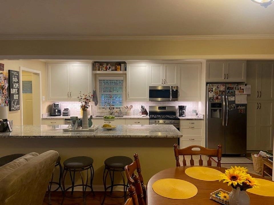 5111 Mason Road Memphis, TN 38117 - Photo 5 of 23 a kitchen with a sink cabinets and appliances