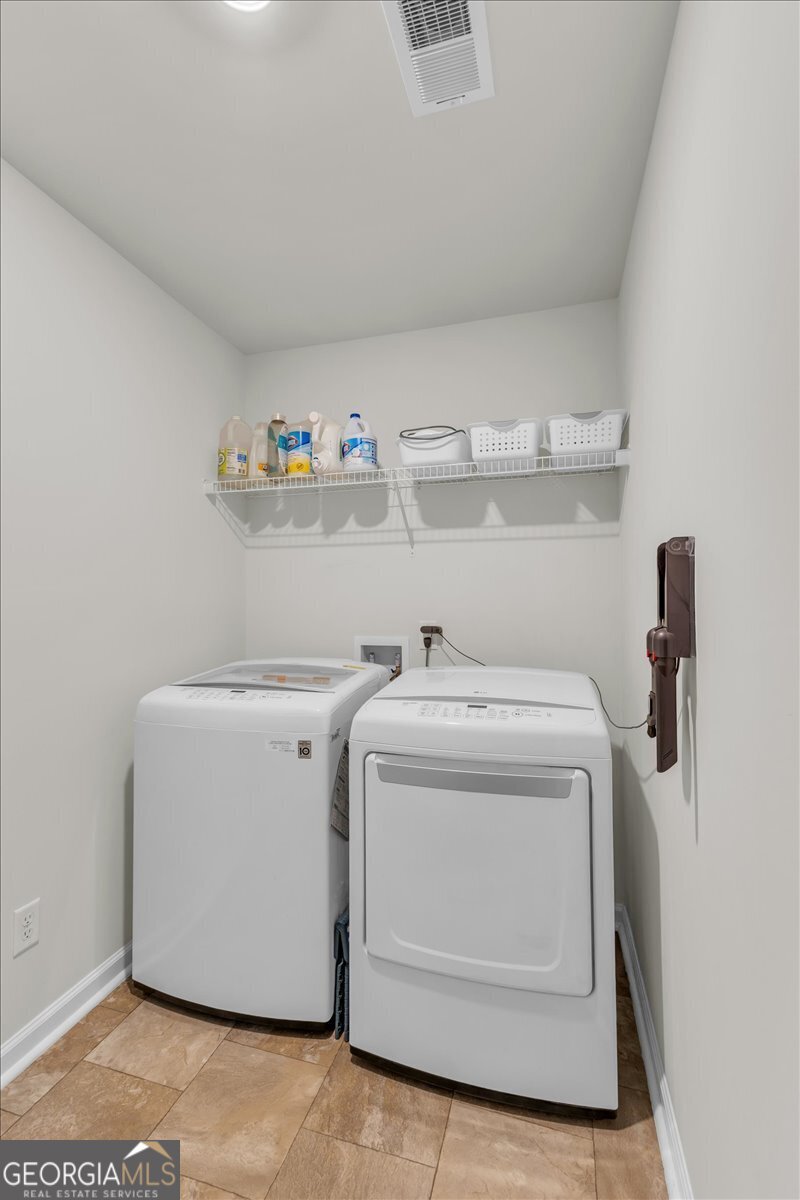 590 Wilkins Road Midway, GA 31320 - Photo 32 of 62 a utility room with dryer and washer