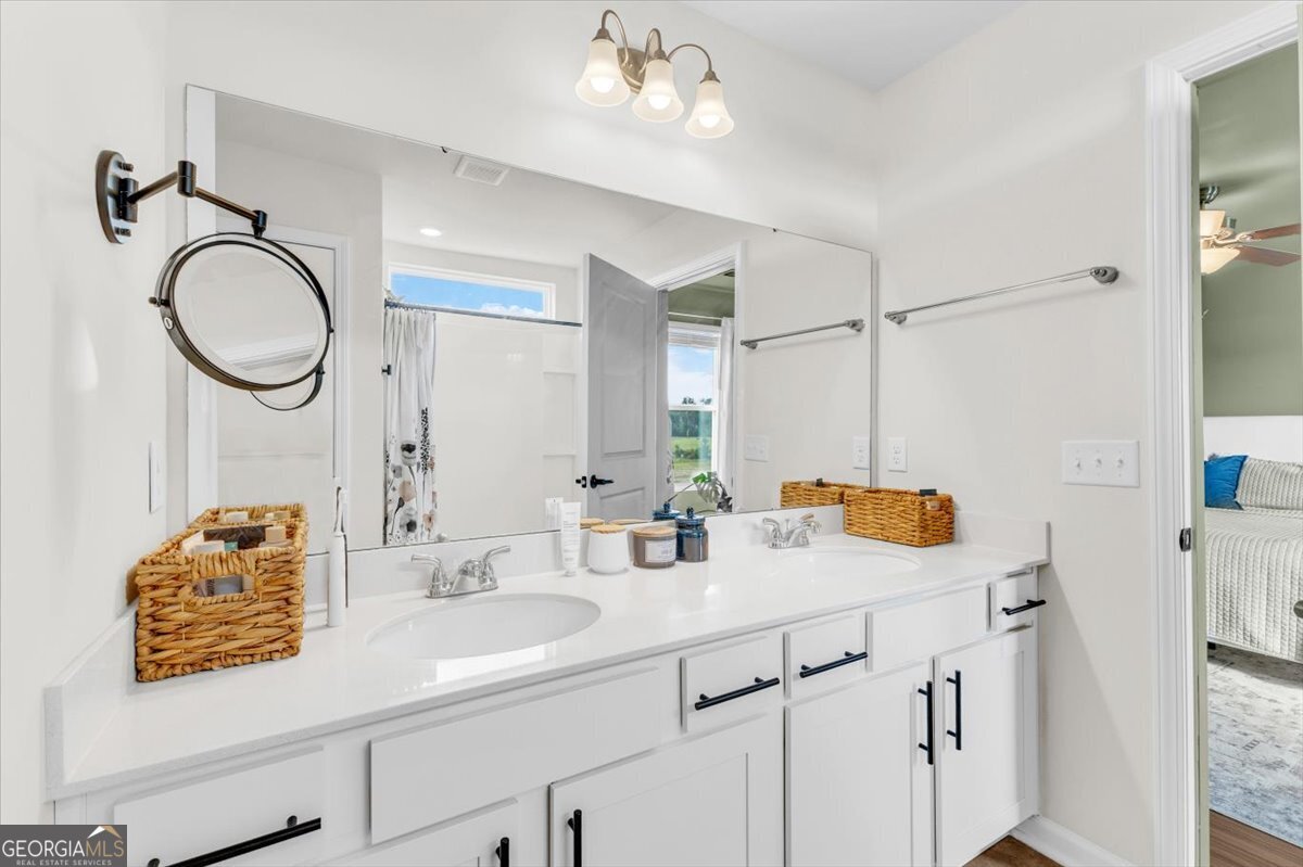 590 Wilkins Road Midway, GA 31320 - Photo 36 of 62 a bathroom with a sink vanity and mirror