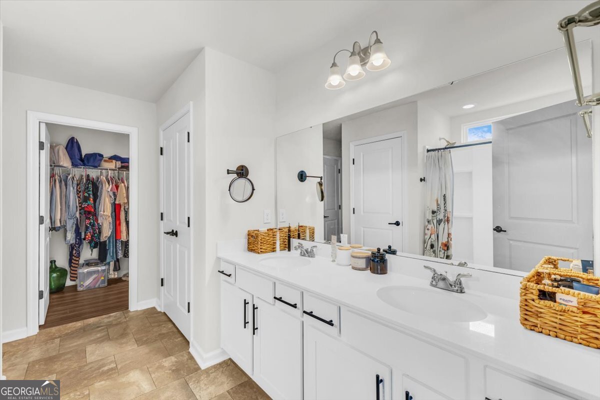 590 Wilkins Road Midway, GA 31320 - Photo 37 of 62 a bathroom with a sink vanity and a mirror