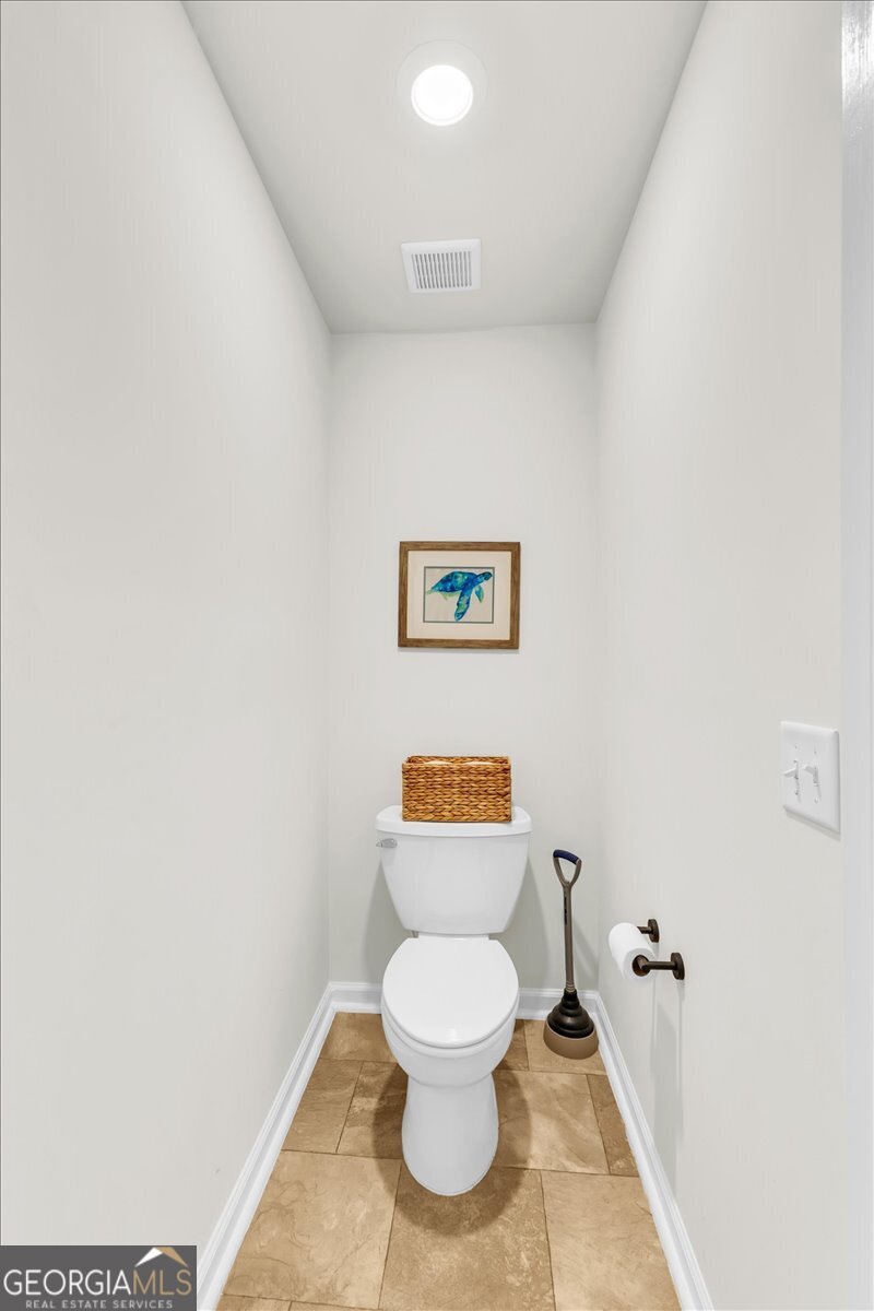 590 Wilkins Road Midway, GA 31320 - Photo 42 of 62 a bathroom with a toilet and a shower