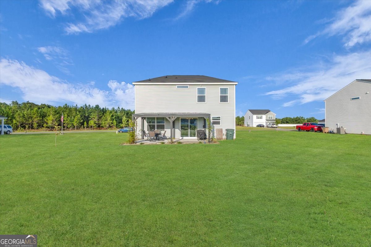 590 Wilkins Road Midway, GA 31320 - Photo 53 of 62 a view of a house with a big yard