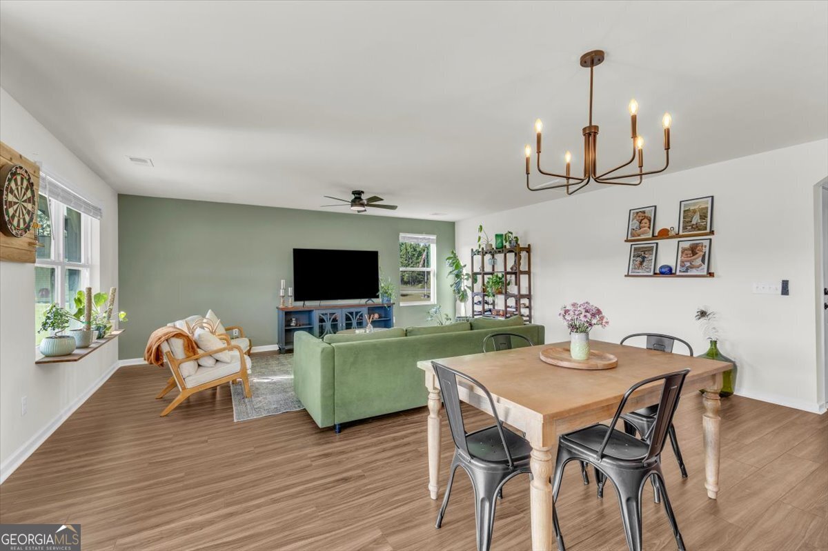 590 Wilkins Road Midway, GA 31320 - Photo 9 of 62 a living room with furniture and a flat screen tv