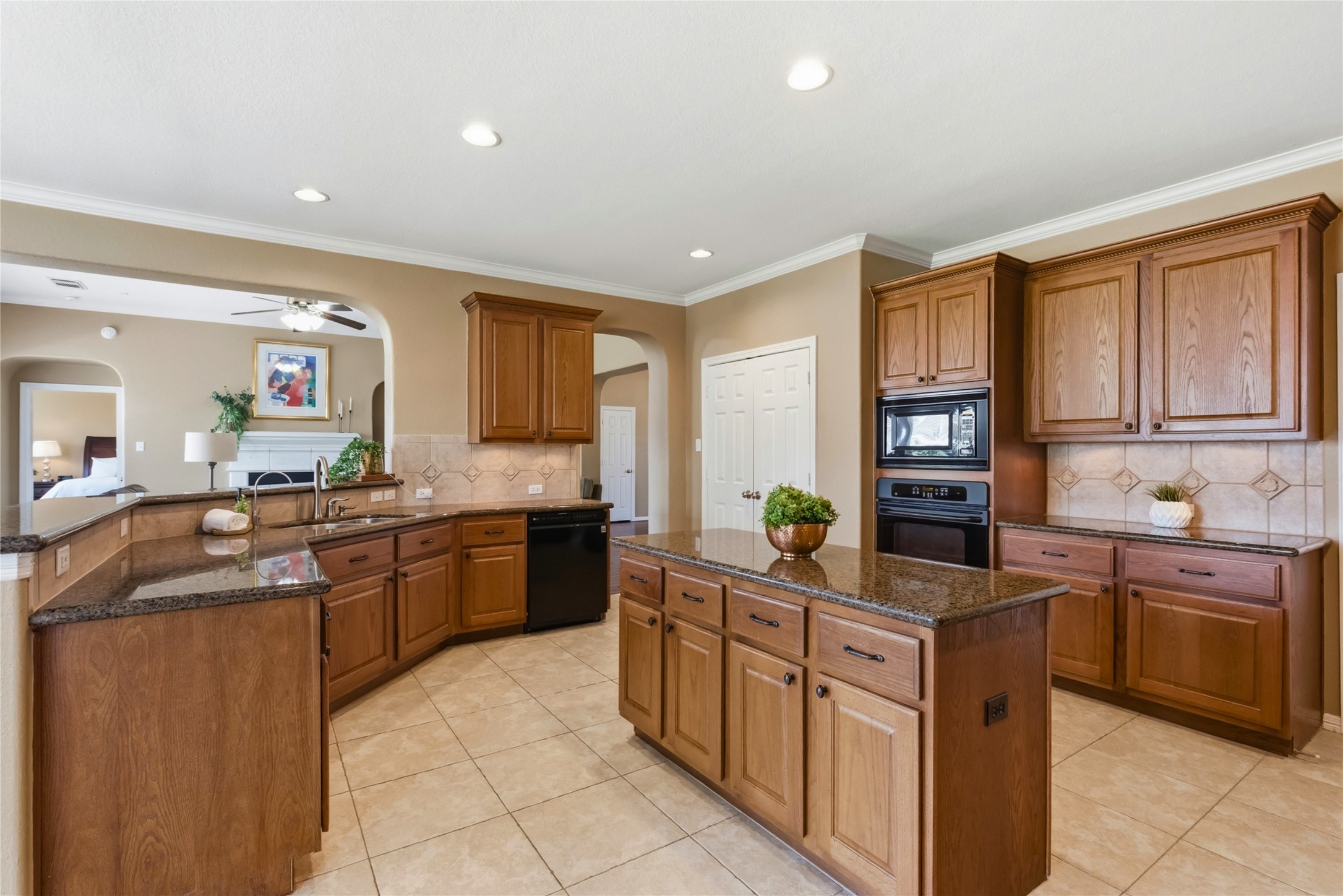 20722 Windrose Bend Drive Spring, TX 77379 - Photo 15 of 50 Your daily routine is a breeze in this dynamic & expansive island kitchen with granite countertops & loads of available storage.