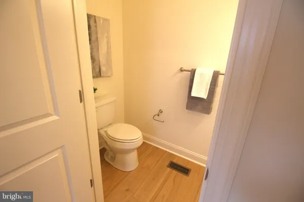 a bathroom with a white toilet and sink