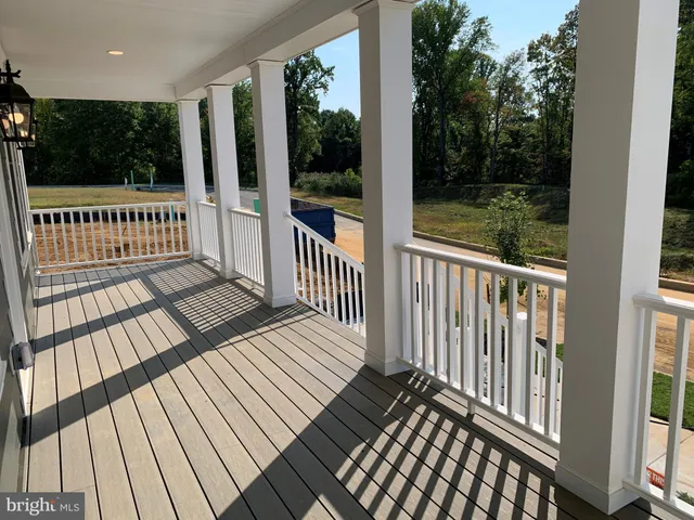 a view of a balcony with wooden floor