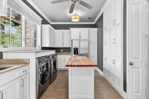 a kitchen with a stove a sink and a refrigerator