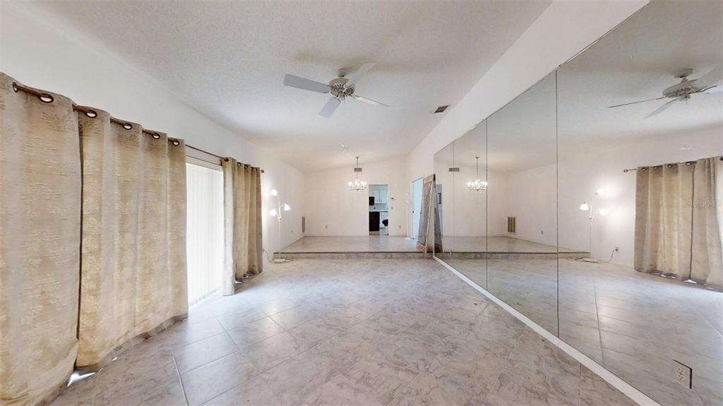 53 North Archwood Drive Inverness, FL 34450 - Photo 15 of 81 a view of a livingroom with a ceiling fan and window