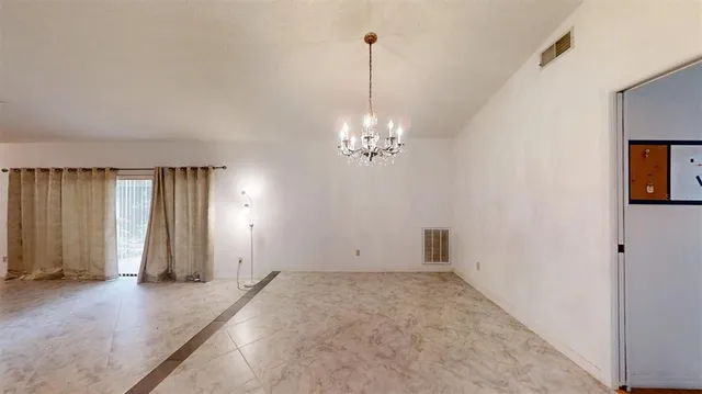 a kitchen with granite countertop white cabinets white stainless steel appliances and sink