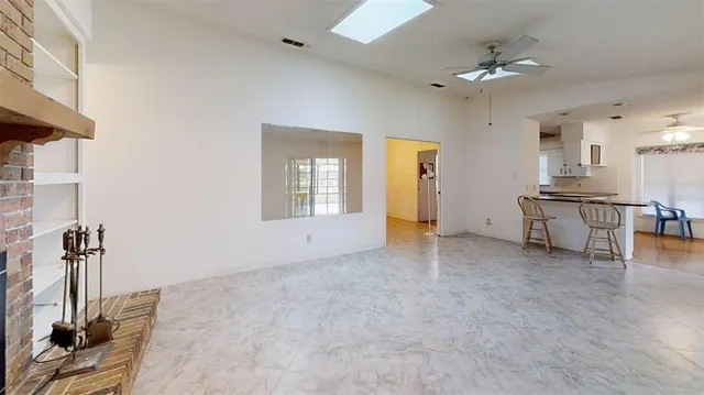 a kitchen with granite countertop a sink and steel appliances
