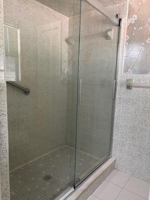 53 North Archwood Drive Inverness, FL 34450 - Photo 48 of 81 a bathroom with a glass shower door