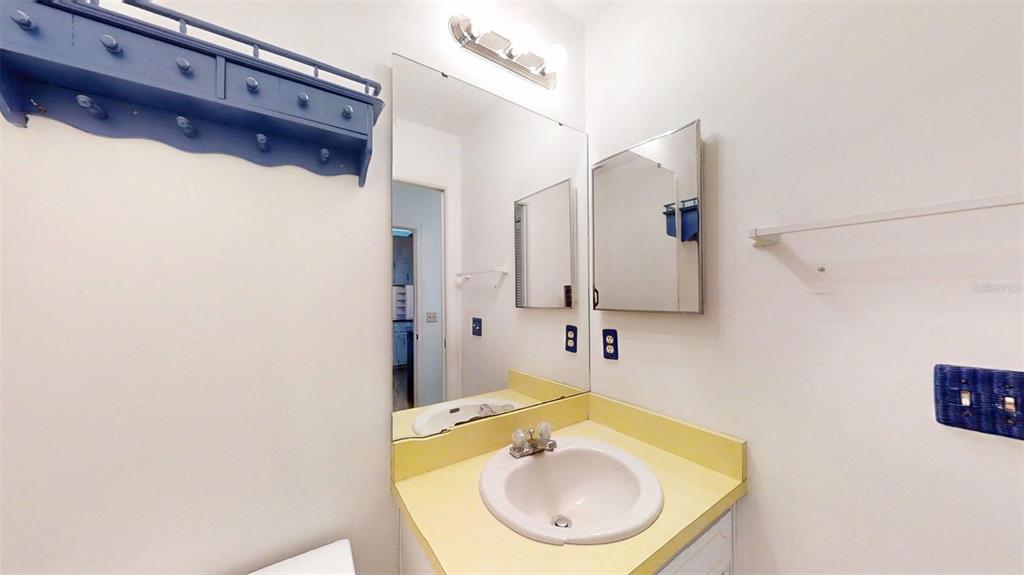 53 North Archwood Drive Inverness, FL 34450 - Photo 58 of 81 a bathroom with a sink and mirror