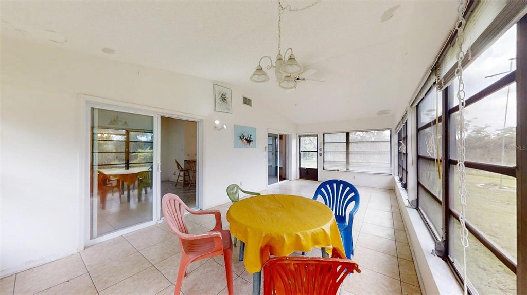 53 North Archwood Drive Inverness, FL 34450 - Photo 62 of 81 a bedroom with a bed and wooden floor