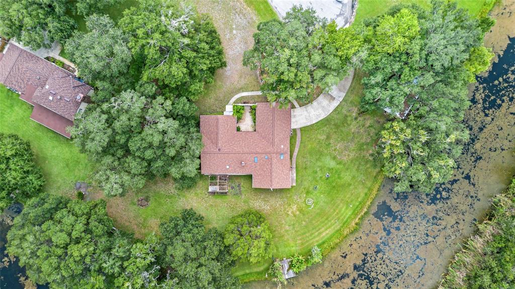 53 North Archwood Drive Inverness, FL 34450 - Photo 9 of 81 an aerial view of a house with a yard