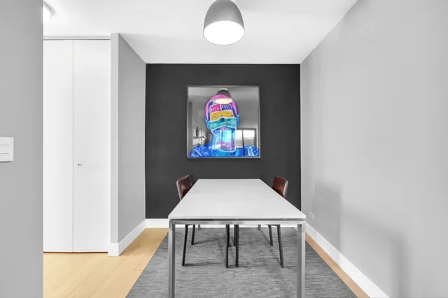 a view of dinning table and chairs in a room