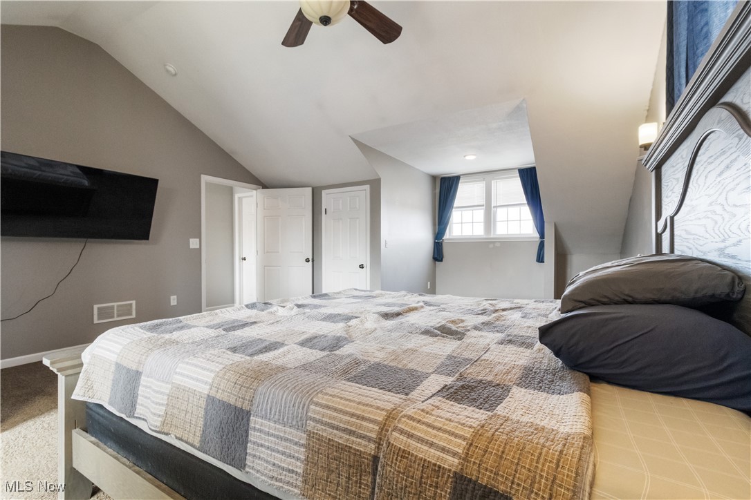 57459 Shry Road Barnesville, OH 43713 - Photo 14 of 44 Carpeted bedroom with vaulted ceiling and a ceiling fan