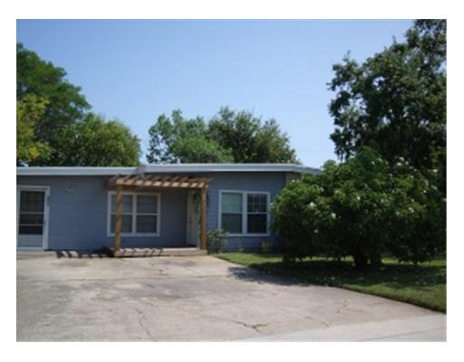 a house with trees in the background