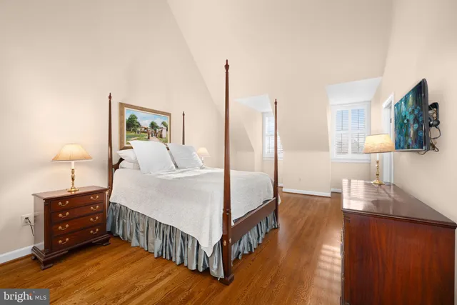 a bed room with bed and window