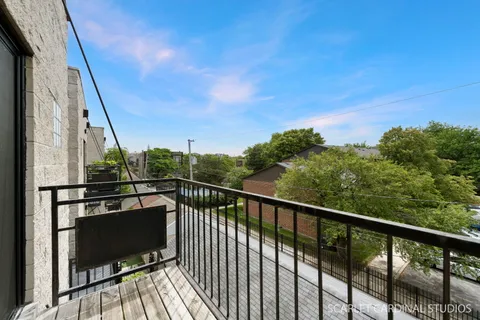 a view of balcony with furniture