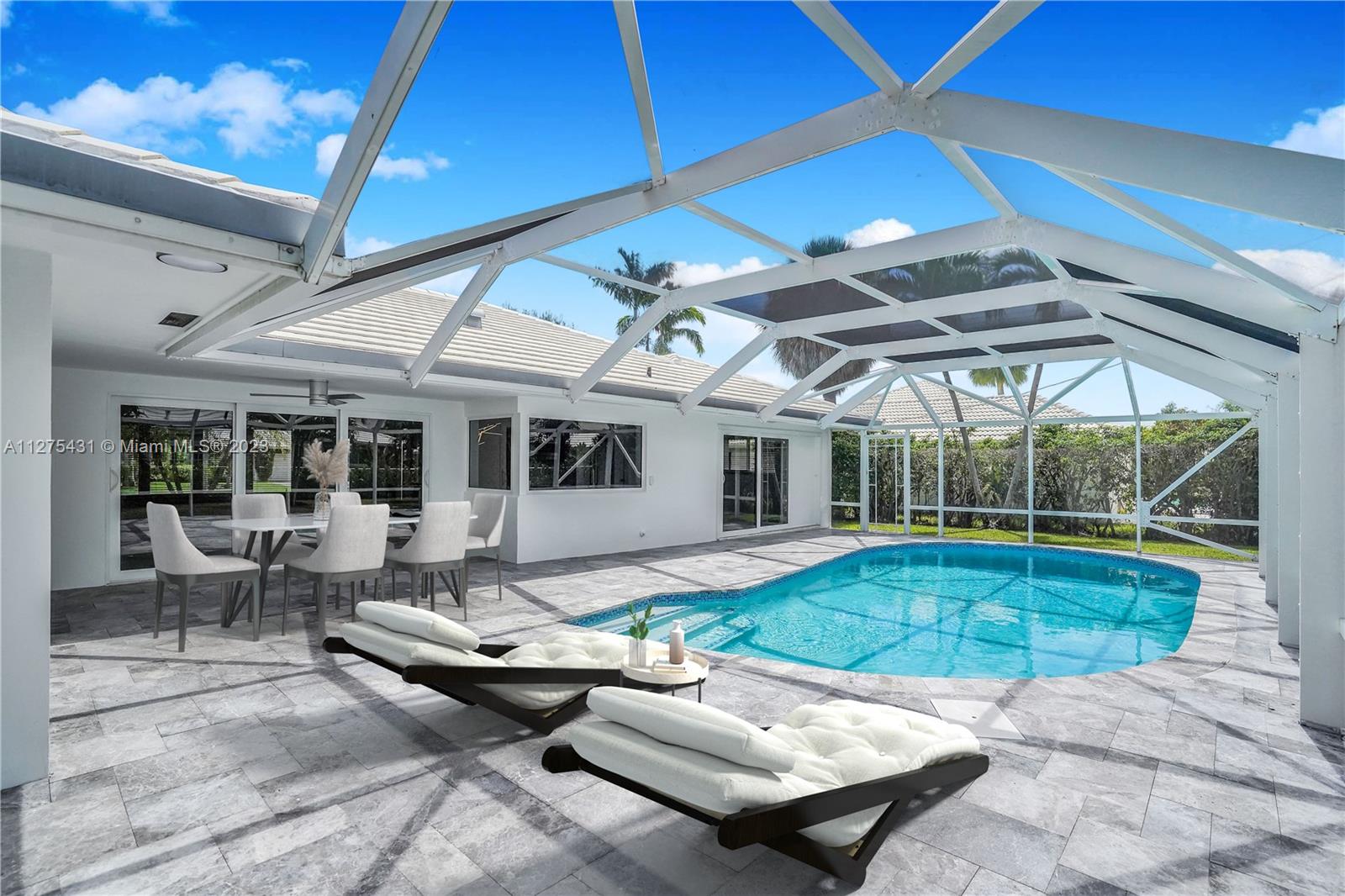 1311 Mulberry Way Boca Raton, FL 33486 - Photo 1 of 45 a swimming pool with outdoor seating and yard