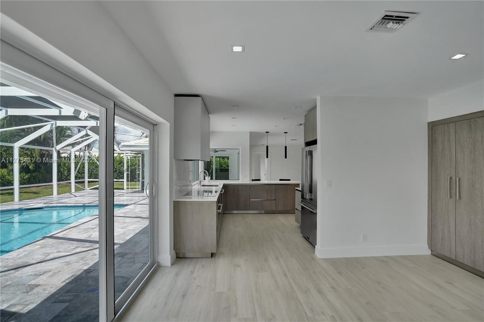 1311 Mulberry Way Boca Raton, FL 33486 - Photo 13 of 45 a living room with furniture and a large window