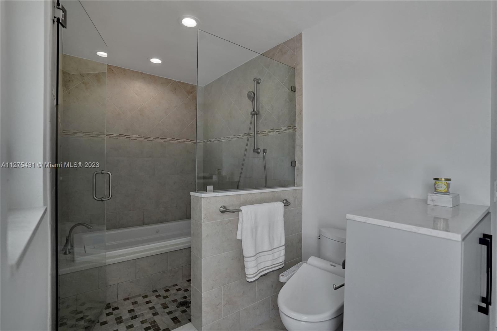 1311 Mulberry Way Boca Raton, FL 33486 - Photo 23 of 45 a bathroom with a sink a toilet and shower