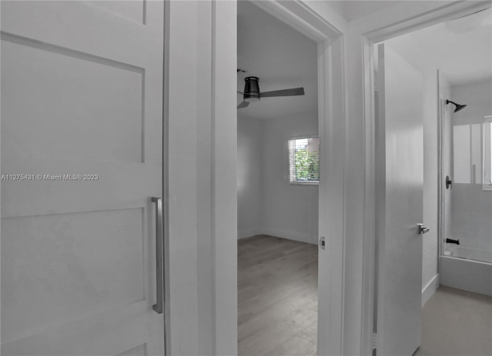 1311 Mulberry Way Boca Raton, FL 33486 - Photo 28 of 45 a bathroom with a light fixture and a shower