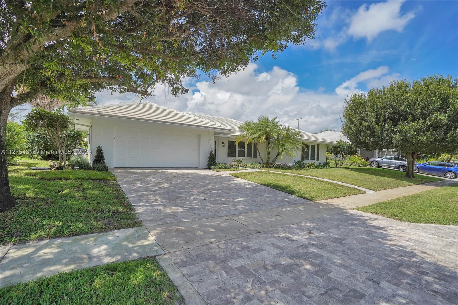 1311 Mulberry Way Boca Raton, FL 33486 - Photo 35 of 45 a view of a house with a yard