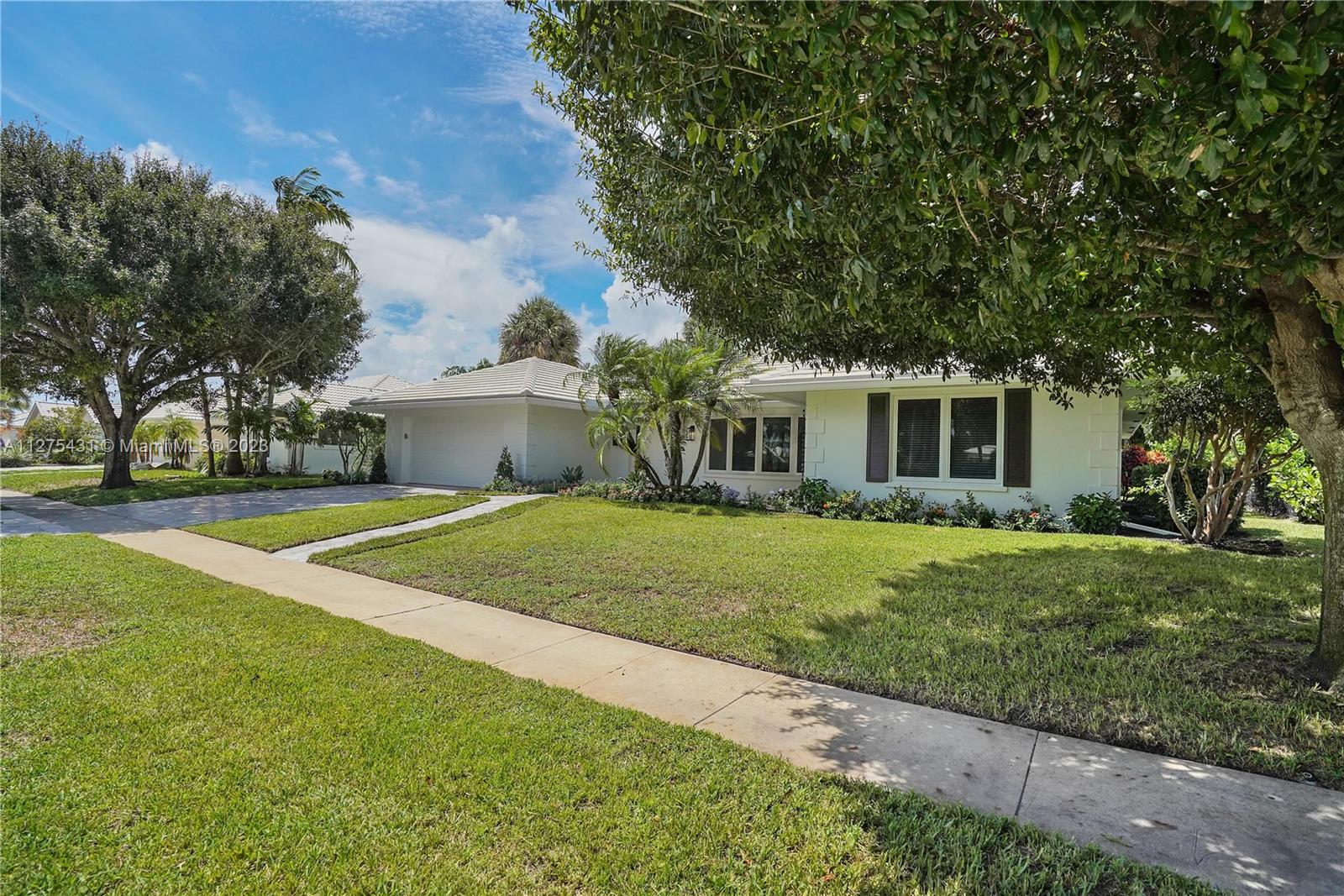 1311 Mulberry Way Boca Raton, FL 33486 - Photo 38 of 45 a view of a house with a yard
