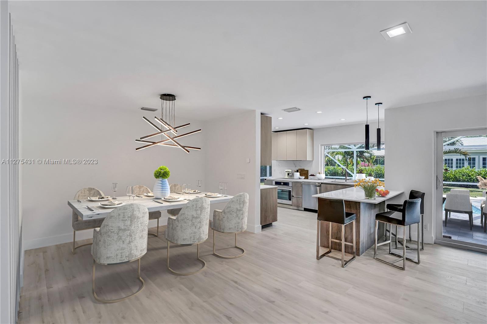 1311 Mulberry Way Boca Raton, FL 33486 - Photo 4 of 45 a dining room with furniture window and wooden floor