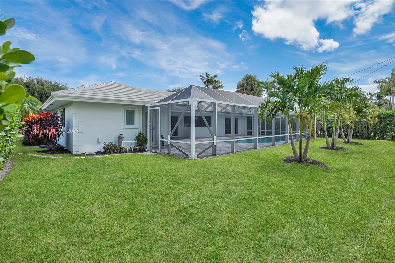 1311 Mulberry Way Boca Raton, FL 33486 - Photo 42 of 45 a view of a house with backyard and a tree