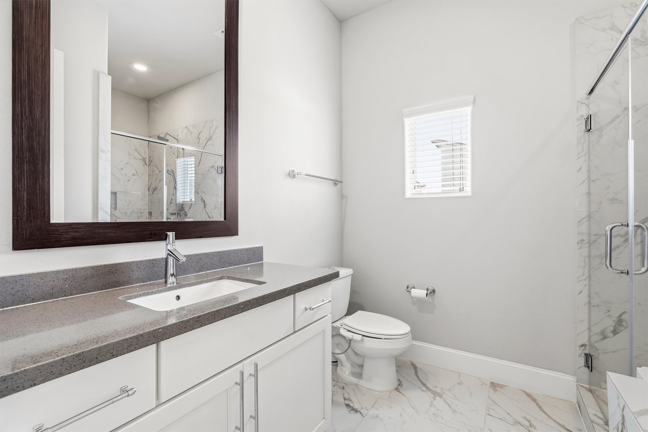 9614 Riddlewood Lane Houston, TX 77025 - Photo 15 of 23 a bathroom with a sink toilet and shower
