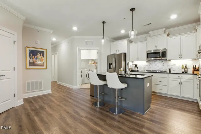 a view of a dining room with furniture and window
