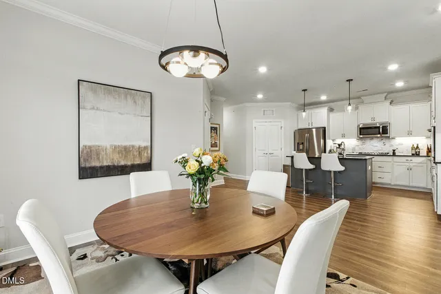 a bathroom with a sink a large mirror and a bathtub next to a window