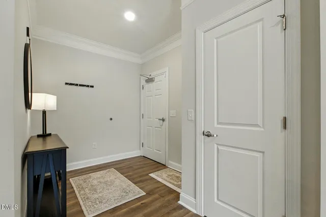 a living room with furniture fireplace and a large window