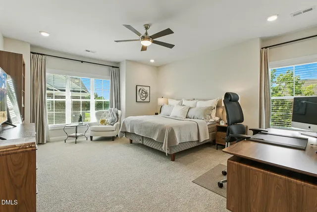 a front view of a house with swimming pool and a yard