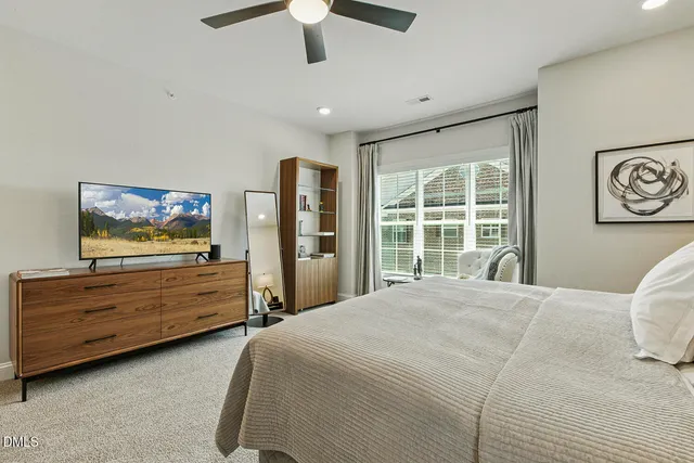 an aerial view of residential houses with yard