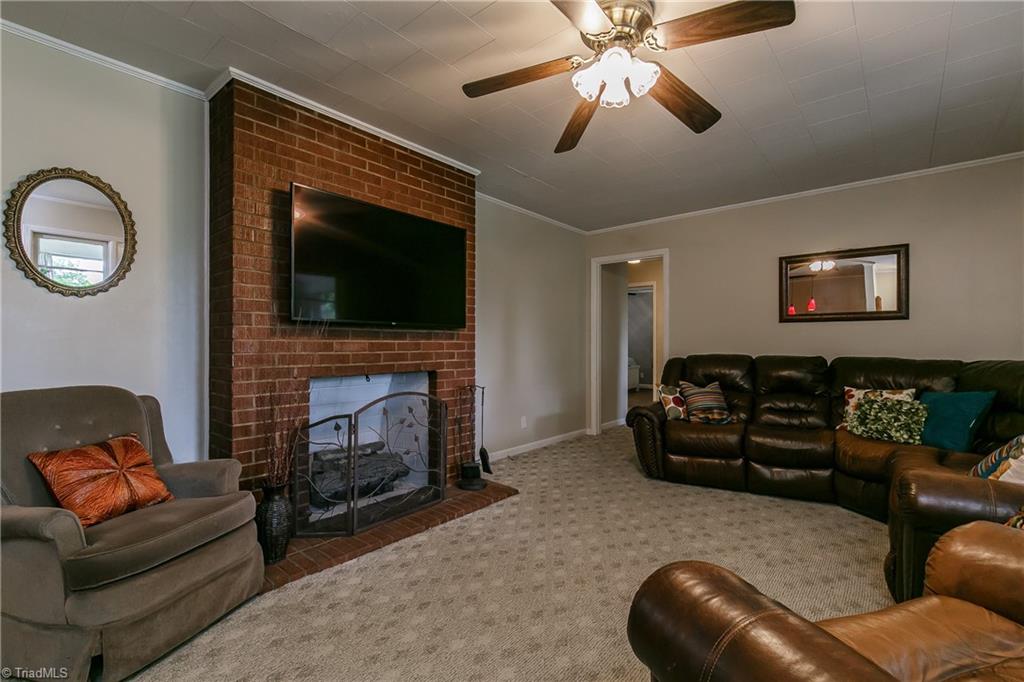 1336 A Townbranch Road Graham, NC 27253 - Photo 11 of 36 Brick surround gas log fireplace is the centerpiece of the family room