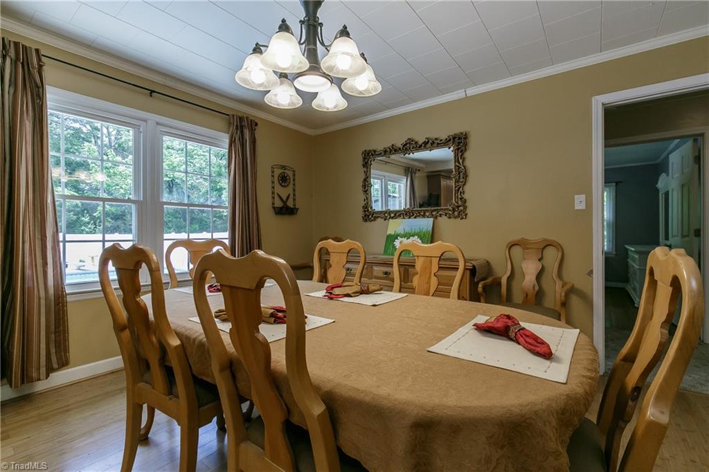 1336 A Townbranch Road Graham, NC 27253 - Photo 16 of 36 Double window in dining room offers natural light and views of the pool
