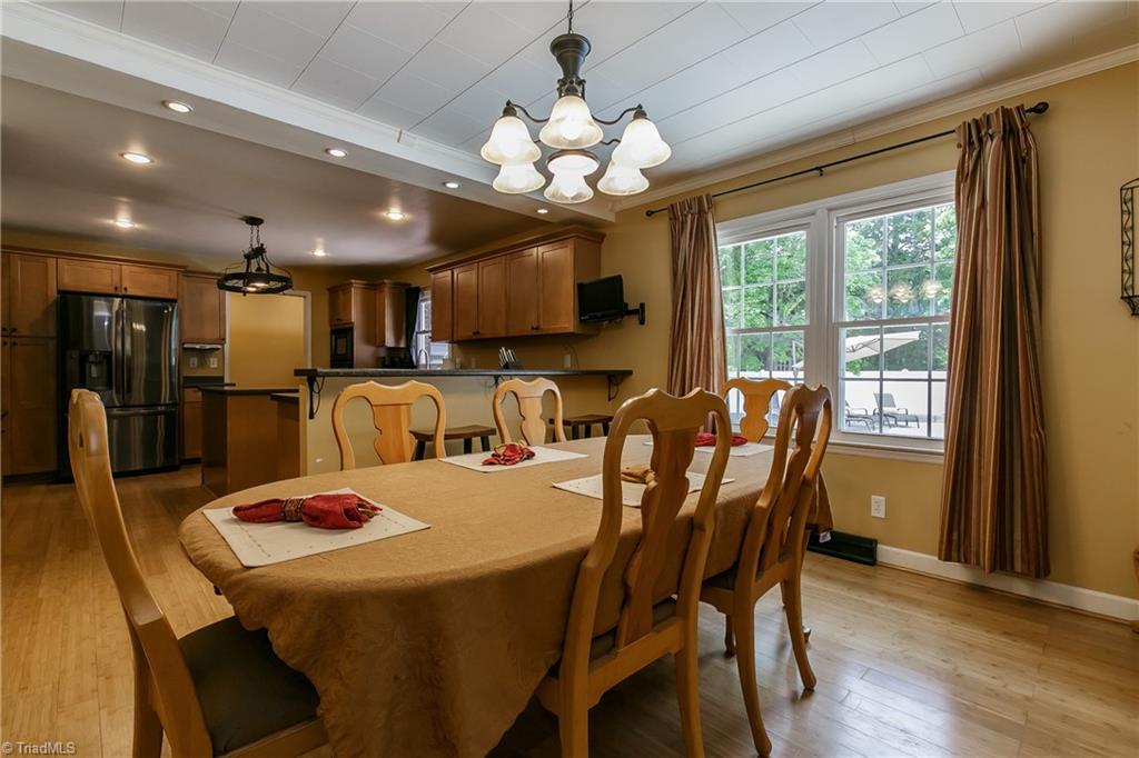 1336 A Townbranch Road Graham, NC 27253 - Photo 17 of 36 Elegant light fixture hangs over dining room table