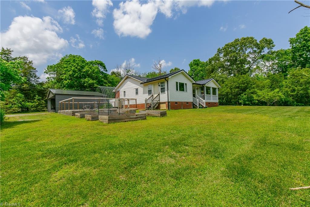 1336 A Townbranch Road Graham, NC 27253 - Photo 29 of 36 Ample gardening area offers 5 garden boxes & fenced in garden plot measuring 26'x23'