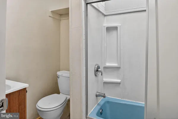 a bathroom with a toilet and a sink