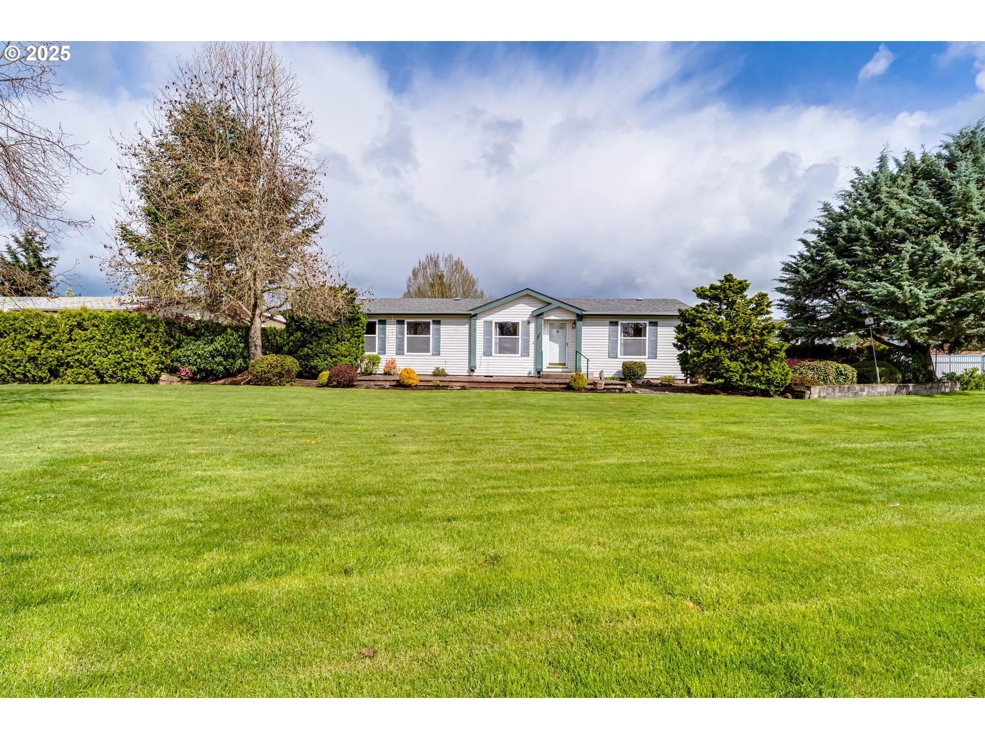 5353 Club Drive Eugene, OR 97402 - Photo 30 of 34 a view of house with yard and trees in the background