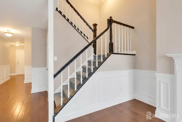 a view of an entryway with wooden floor
