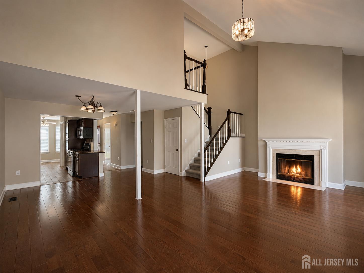 91 Delaware Lane Somerville, NJ 08876 - Photo 12 of 33 a view of a livingroom with wooden floor and a fireplace