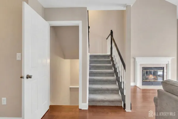 a view of staircase with white walls and a window