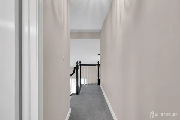 a view of a hallway with a white walls