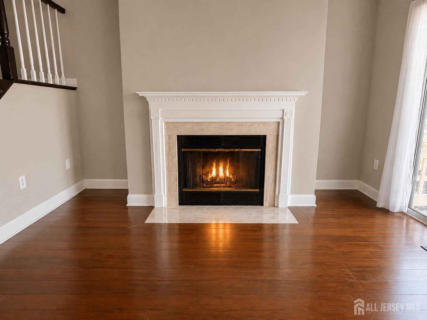 91 Delaware Lane Somerville, NJ 08876 - Photo 13 of 33 a living room with wooden floor and a fireplace